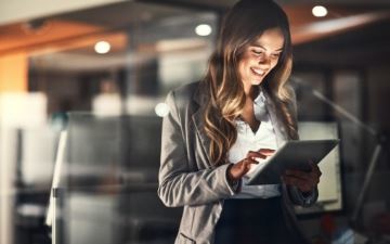Lady looking at her tablet.