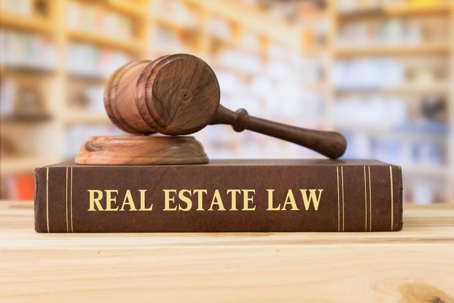 real estate law book and gavel